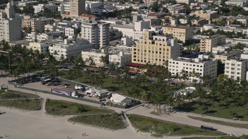 Aerial footage of South Beach Miami Beach Florida showing the maintenance base camp and surrounding buildings and people on the beach