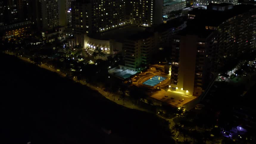 Aerial flyby of Miami Beach Floridas beachfront hotels during a clear night