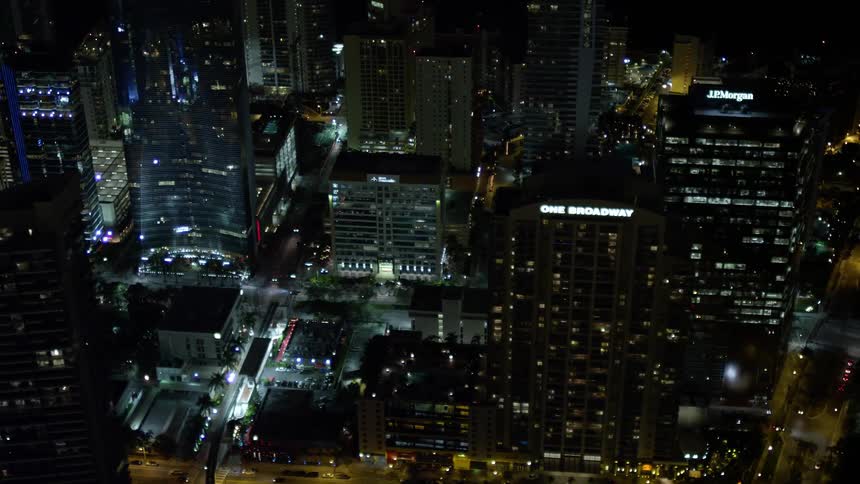 This video clip showcases the nighttime view of skyscrapers in Downtown Miami Florida providing a clear and detailed aerial view of the citys metropolitan area