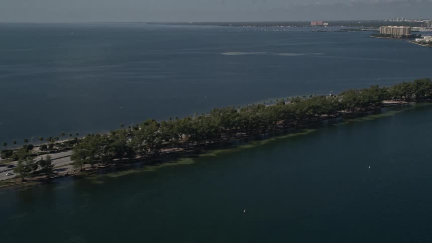 Light traffic crossing the Rickenbacker Causeway providing a scenic aerial view of the downtown Miami skyline