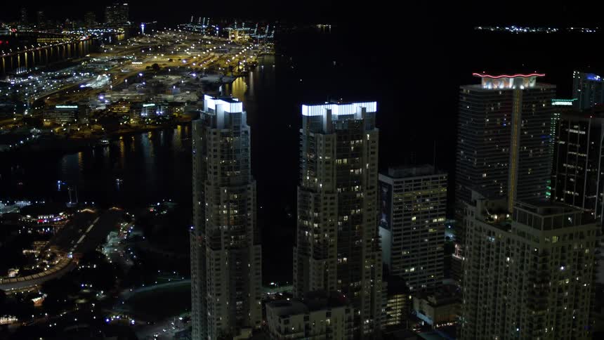 A breathtaking aerial view of Vizcayne Towers lighting up the night sky in mesmerizing Downtown Miami