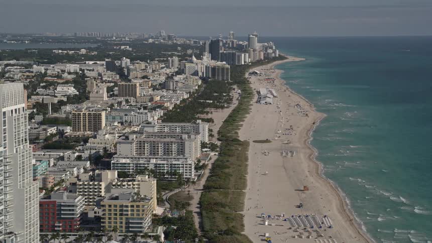 Fly over South Beachs coastline and reveal Miami Beachs impressive skyscrapers and buildings - a sunny and leisurely sightseeing experience