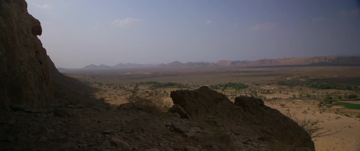 Aerial view of a landscape at dusk is displayed