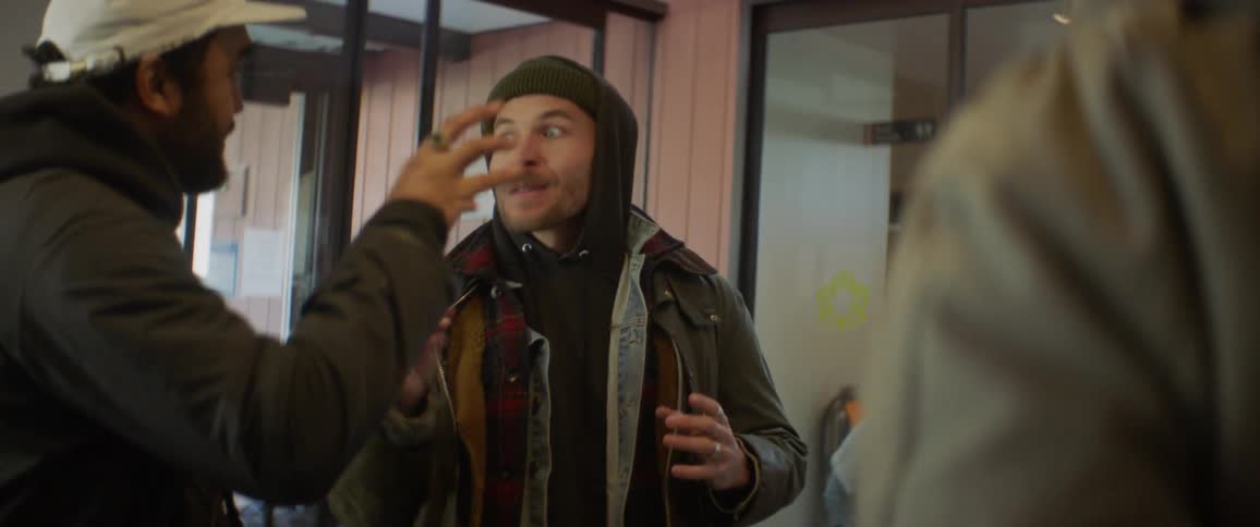 Man talking to another person gesturing and waving his hands