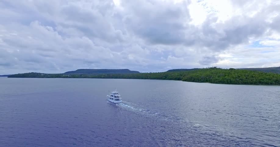 A large boat moving down a body of water