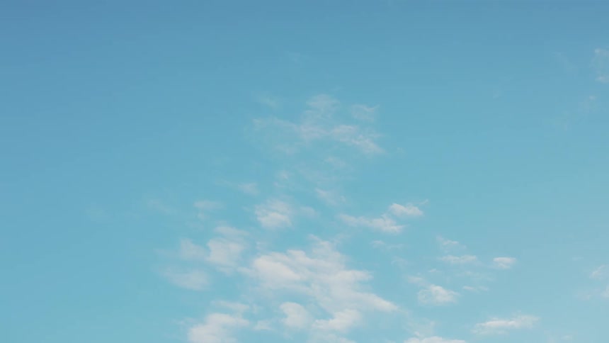 A time lapse of clouds disappearing and the blue sky clearing