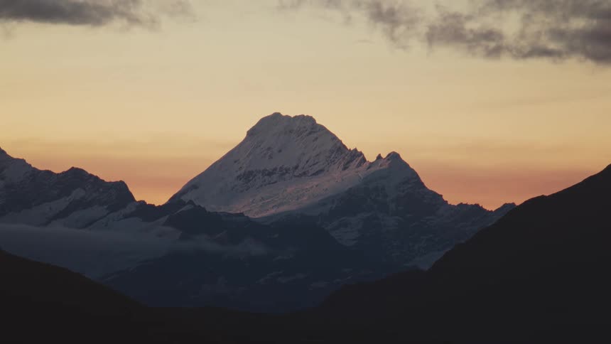 Landscape of snowy mountain at sunset