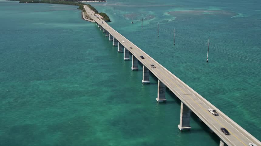 Approaching Fiesta Key bridge on the Overseas Highway from an aerial perspective with vehicles crossing over