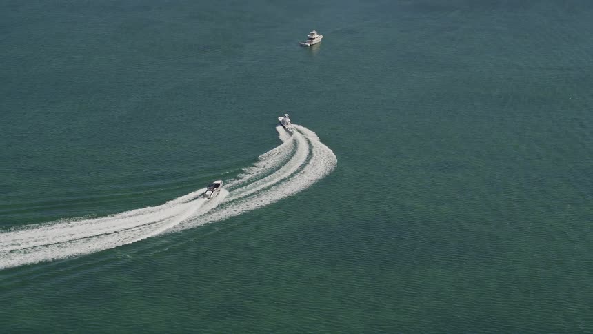 Aerial footage of fishing boats on Blackwater Sound in Key Largo Florida during a sunny summer day