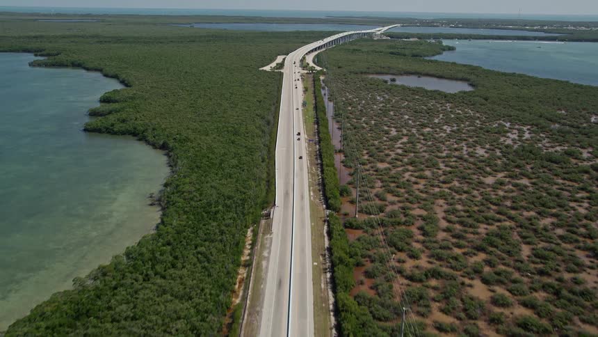A birds eye view of traffic crossing the Overseas Highway in Key Largo Florida