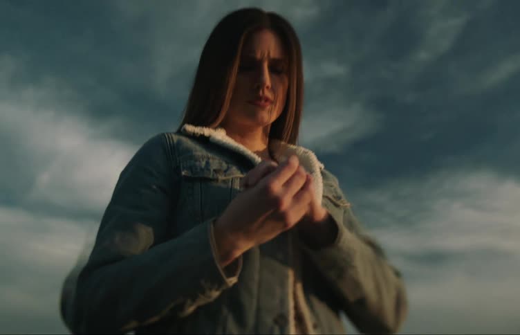 A woman examines her ring