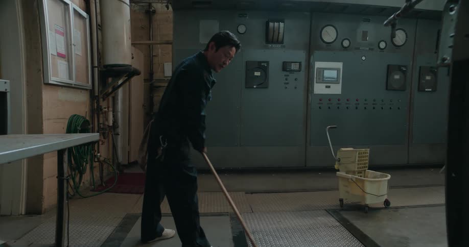 A man is mopping near the machines