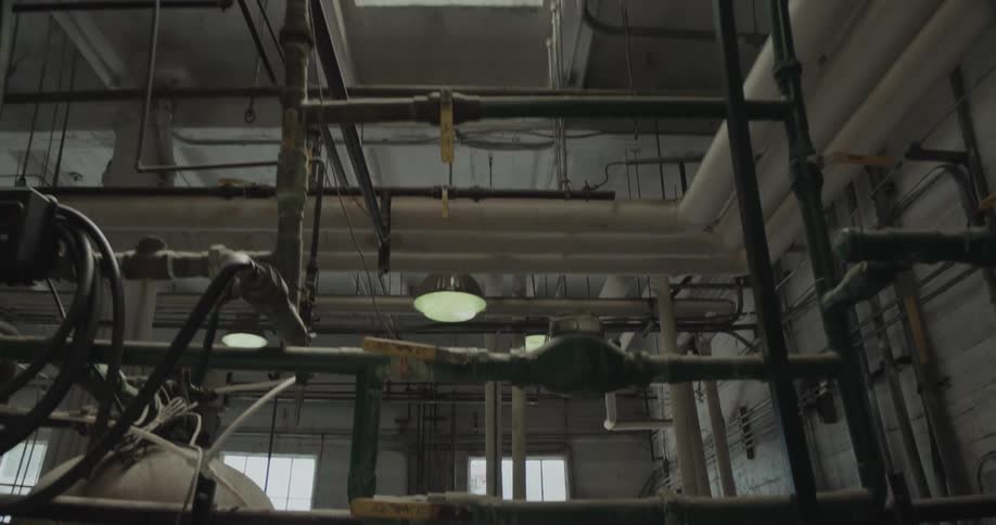 A worker leaves the main floor of the factory