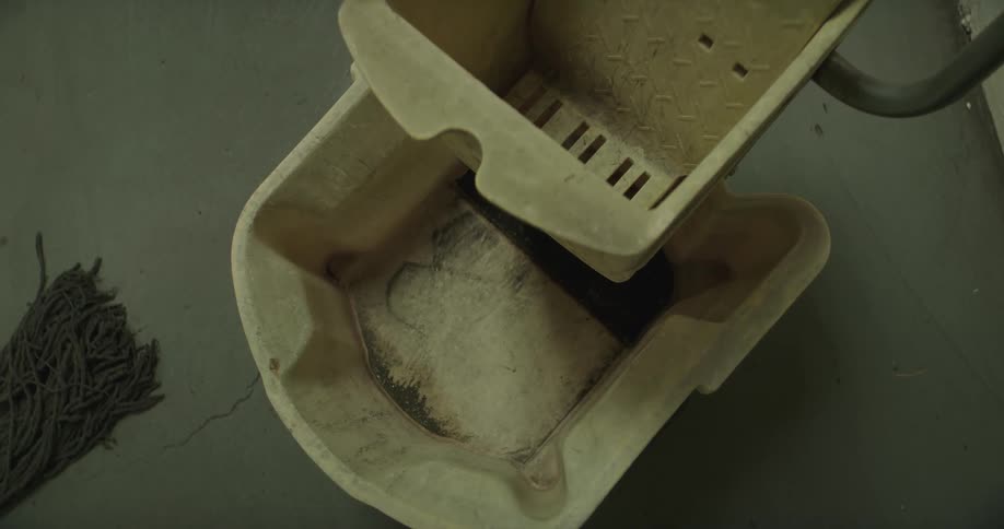 The mop bucket is dirty