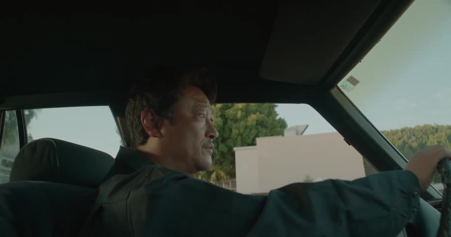 A man is driving a vehicle during the spring time