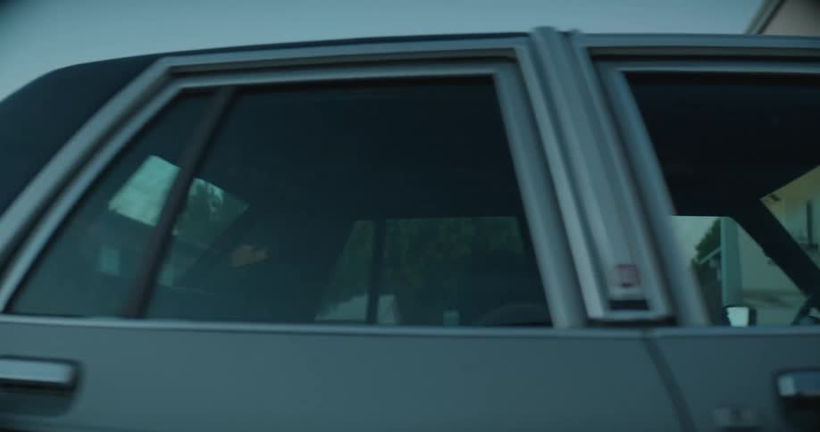 A man is walking outdoors and going to his car
