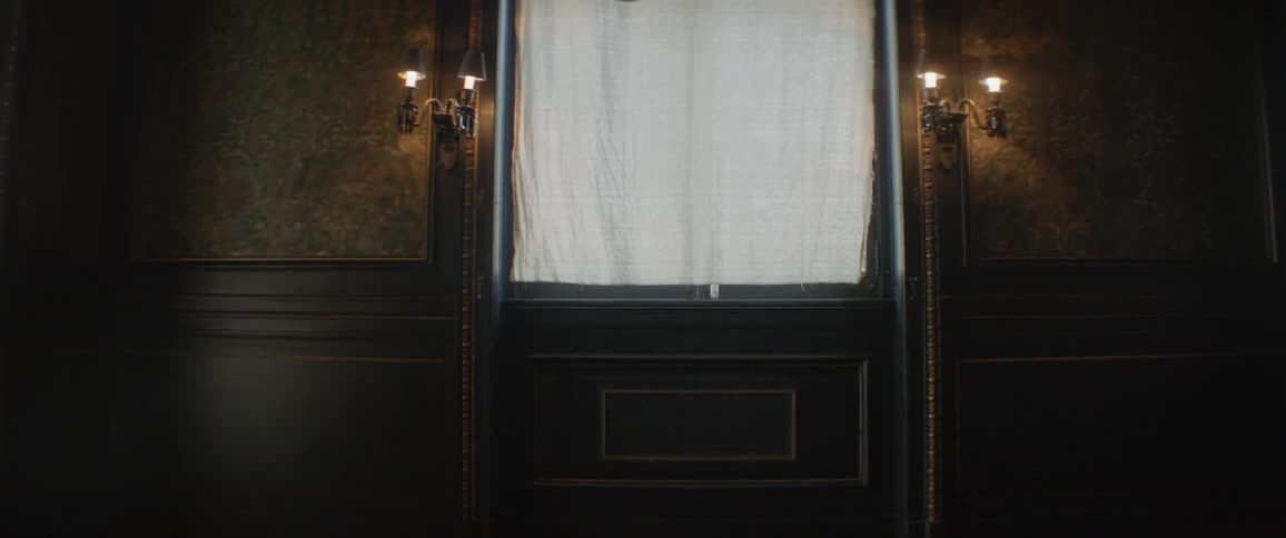 Lights shine on either side of a door