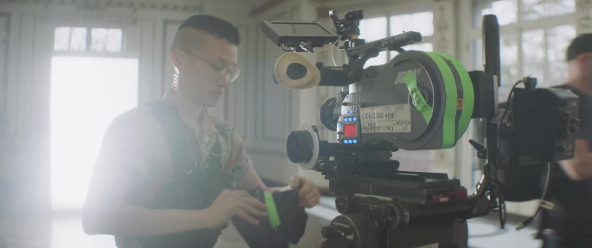 Person puts film in a camera
