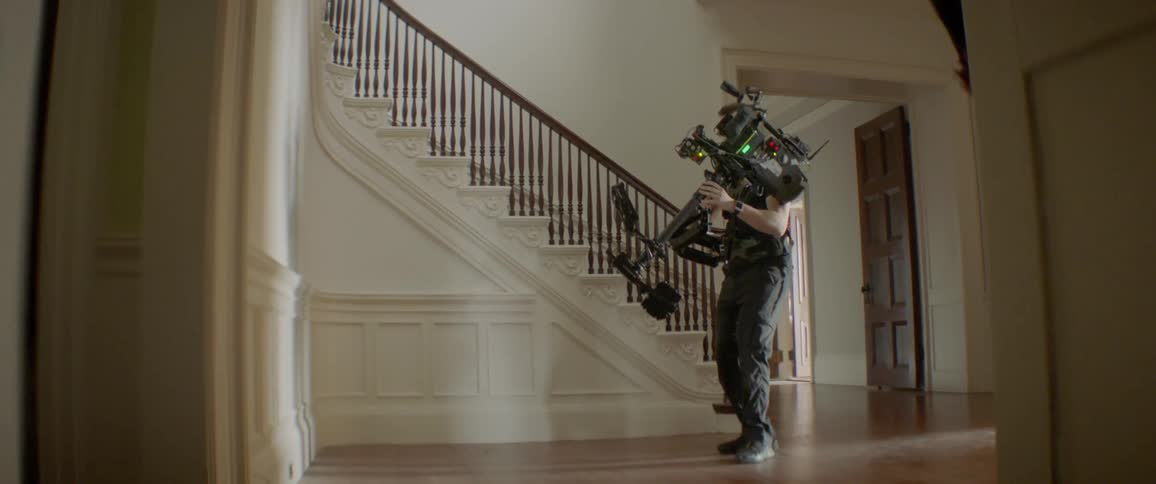 A man falls then stumbles up the steps as he is being filmed