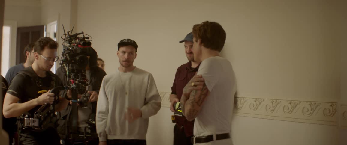 People prepare to film something in the house