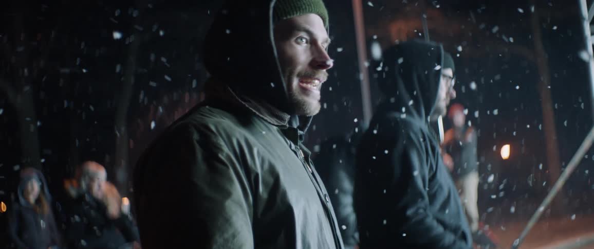 The snow flies around the group of people