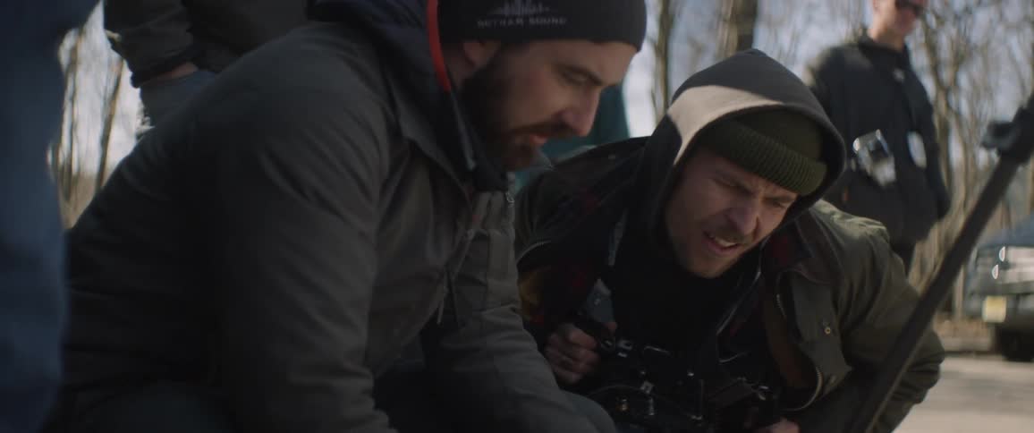 Group of hikers pause to review and discuss something