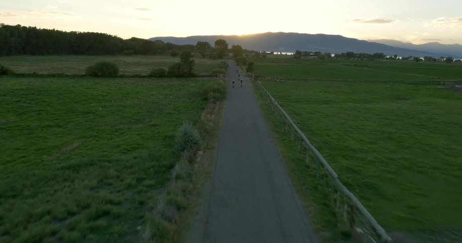 Motorcyclists ride in a rural area