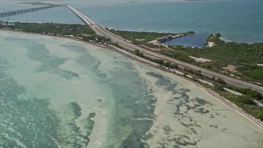 An aerial view of the Overseas Highway and the stunning coast of Bahai Honda Key in Florida during the daytime of summer