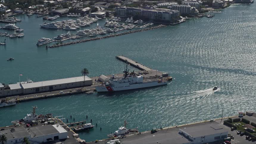 Aerial footage of a US Coast Guard ship docked at Trumbo Point Key West Florida filmed on a sunny day