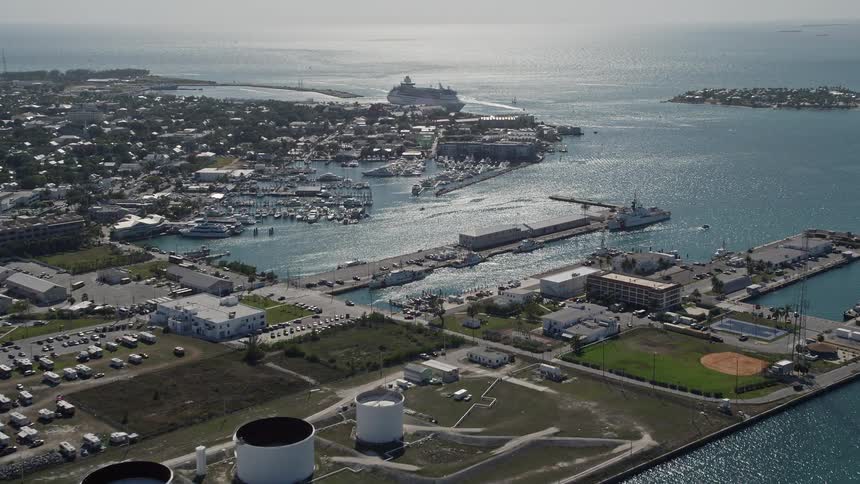 A 5K aerial view of Trumbo Point showcasing a cruise ship docked in the port of Key West Florida during the summer