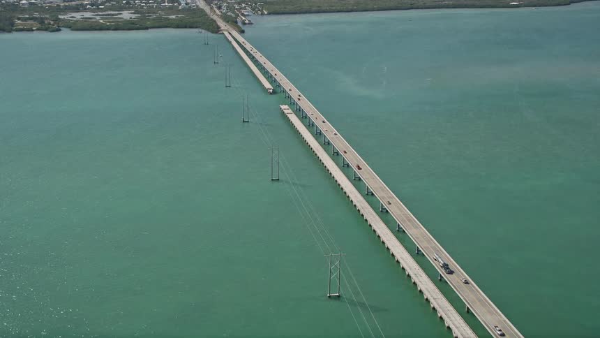 Aerial footage follows the Overseas Highway over Ramrod Key and approaches Summerland Key showcasing the beautiful Florida coastline and bridge crossings