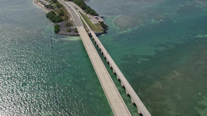 Cars and light traffic crossing the iconic Seven Mile Bridge on the Florida Keys captured in stunning aerial view