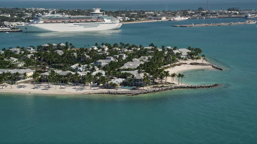 An aerial shot of the residential neighborhoods coastal beaches and empty shorelines of Sunset Key Key West FL during a sunny day in summer