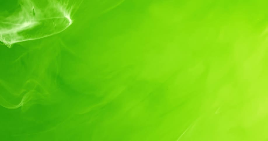 Green and yellow liquids combine together to create a lime green color