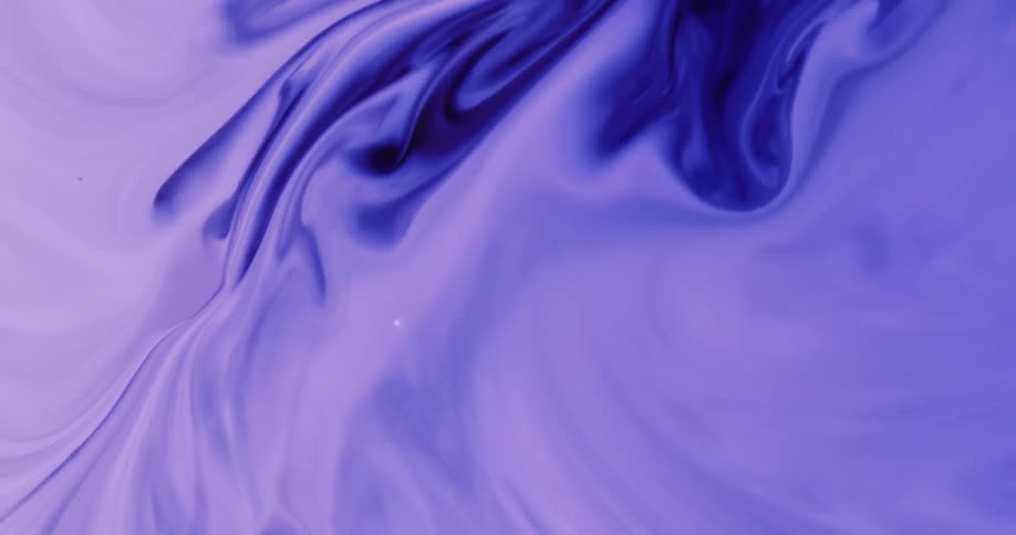 Abstract closeup of light and dark purple liquid or paint swirling and mixing