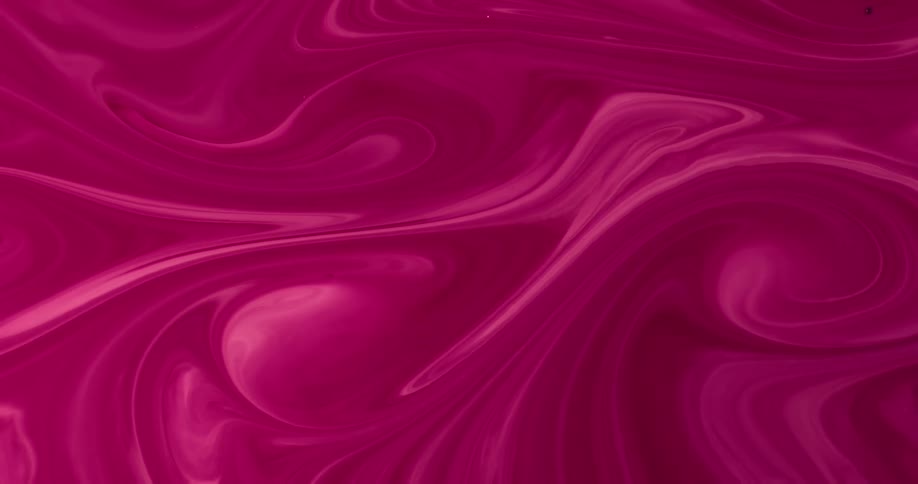 Pink liquid is being mixed together in a pattern