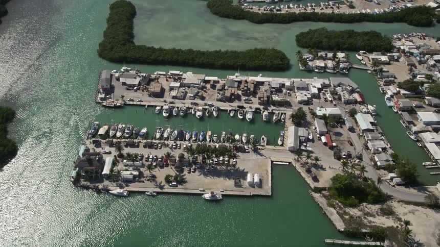An aerial view of boats docked at a marina in Marathon Florida on a sunny day