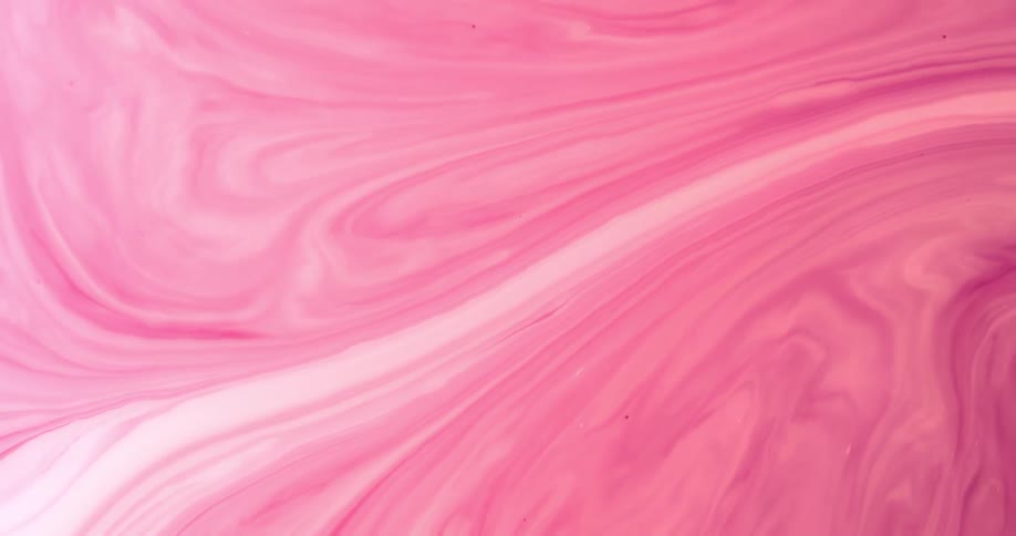 The view is of a liquid color that is pink and it is moving around