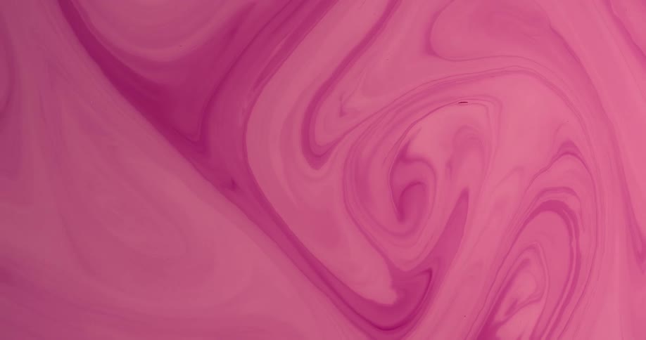 Shades of a pink liquid substance mix and blend as they swirl and move