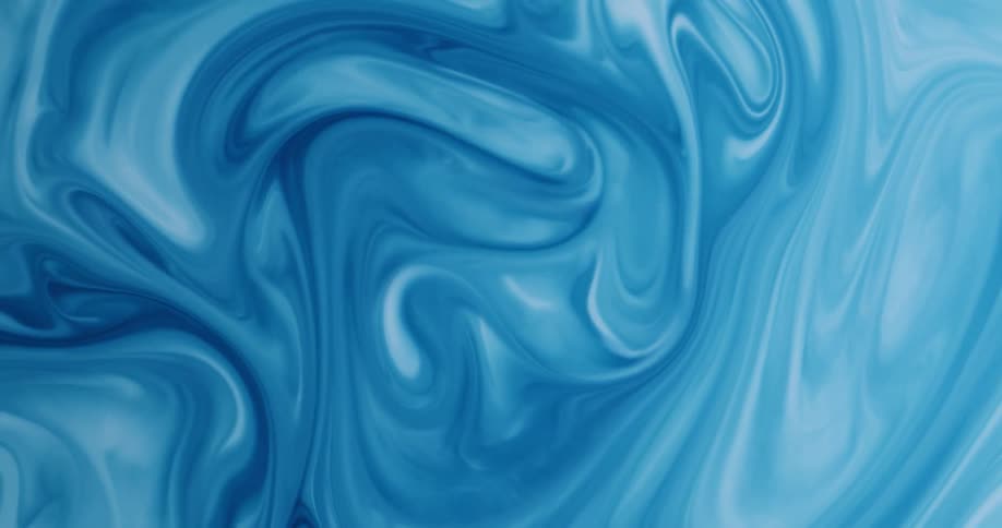 Blue and white layers swirl through paint mixture