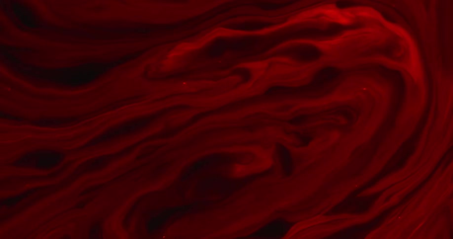 The view is of a red liquid moving around motion