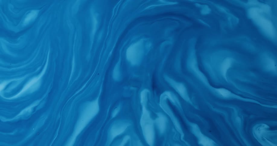 A view of water swirling with blue and white colors