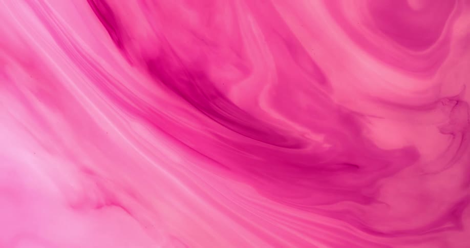 Shades of a pink liquid substance mix and blend as they swirl and move
