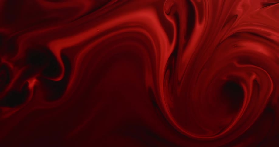 Crimson and black layers flow and swirl in mixture