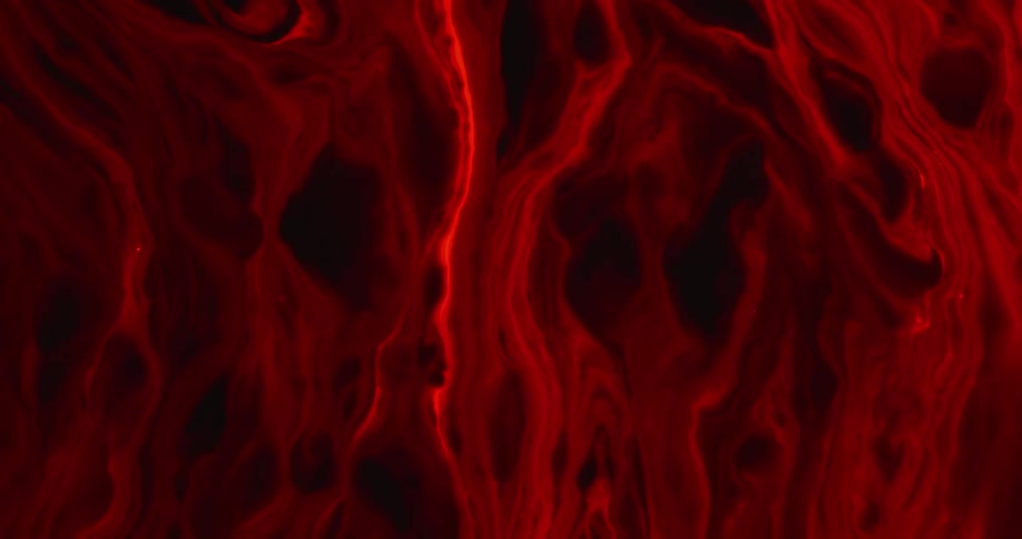 A swirling black and red liquid