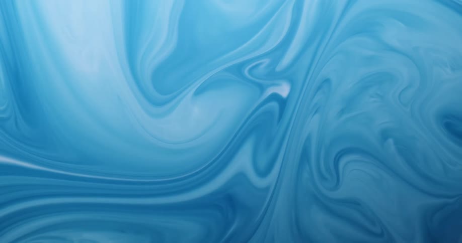 Light blue liquids of different shades swirl around and mix together
