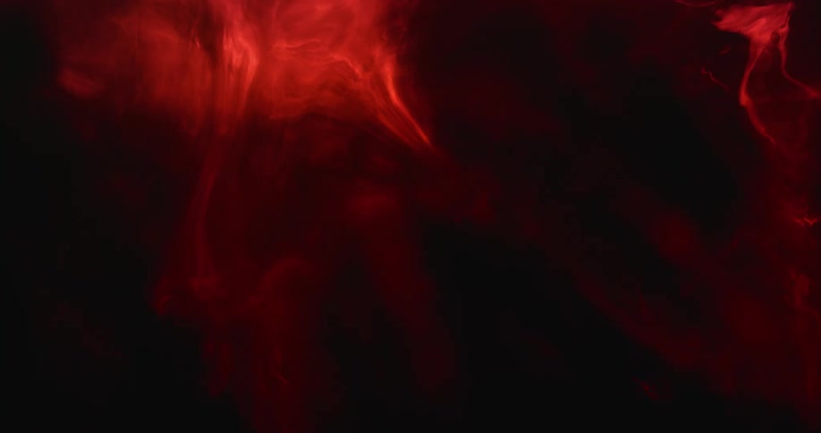 In the darkness some red cloudiness swirls around slowly