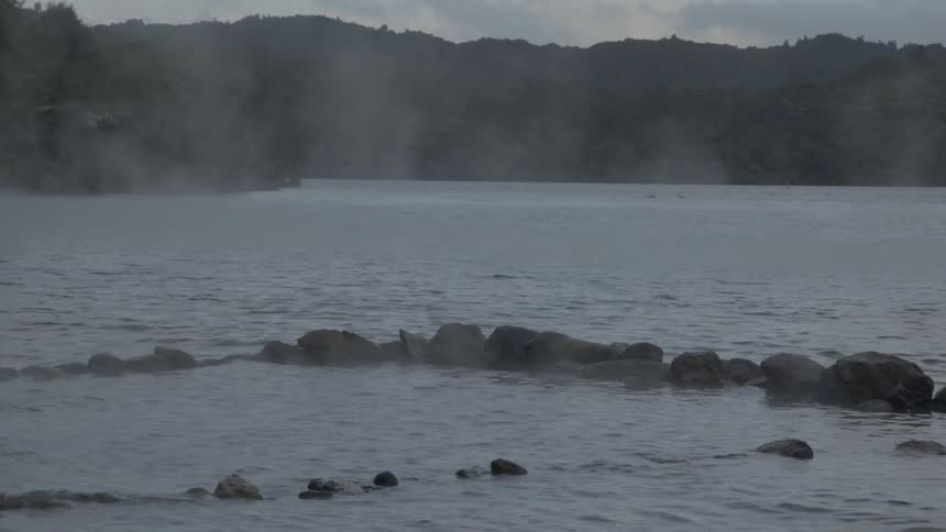 A body of water at the foot of mountains