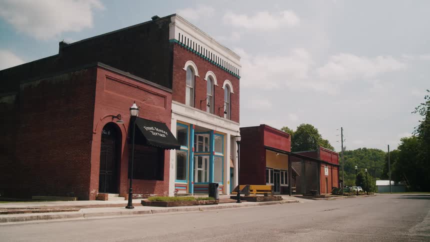 Shot of storefronts on the street of a small town at daytime