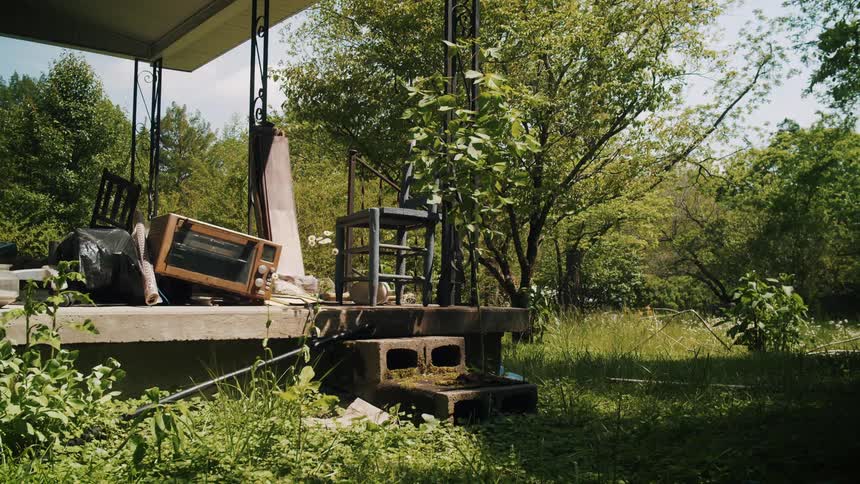Junk is piled on the porch
